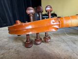 a close up of a violin on a table