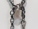 a necklace with a lock and two keys attached to it