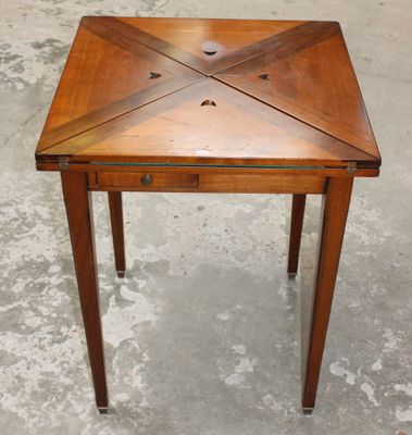an image of a small wooden table with a drawer underneath it