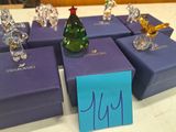 several glass figurines of different shapes and sizes sitting on a table