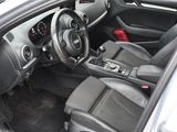 the interior of a car with a steering wheel and dashboard controls