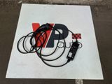 a picture of a sign that has some wires attached to it