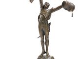 statue en bronze représentant un homme tenant une batte de baseball, posée sur un socle