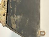 a black and gold picture frame hanging on a wall