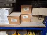 many boxes on a shelf in a warehouse