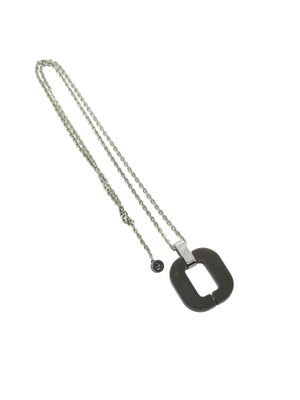 a close up of a necklace on a white background with a chain