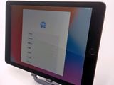 a tablet with a menu displayed on the screen