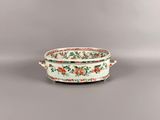 an image of a white bowl with red flowers on it