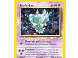 a close up of a pokemon card on a white surface