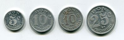four different types of coins are shown on a white surface