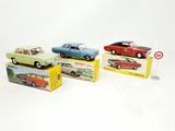 three toy cars that are sitting on top of a box