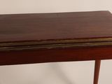a small wooden table with a drawer on top of it