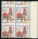 a close up of four stamps with roosters on them