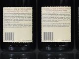 six bottles of wine are lined up on a table