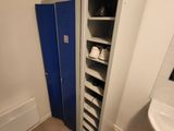 a bathroom with a blue door and a white sink