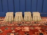 a red rug with a bunch of shoes on top of it
