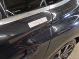 a sticker on the door of a car that says, you ' re here