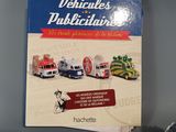 a book that is sitting on a table next to a toy truck