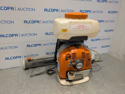 an orange and white blower sitting on top of a table