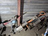 a pile of assorted items in a garage