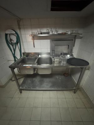 an image of a kitchen with a sink and a stove