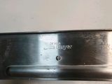 an image of a stainless steel door handle on a white wall