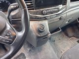 a car dashboard with a steering wheel and dashboard controls