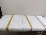 an image of a bed with a sheet on top of it