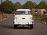 a white truck that is driving down the road