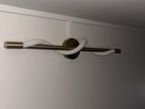 a picture of a bathroom with a toilet paper holder on the wall