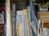 several pieces of wood are stacked on top of each other in a warehouse