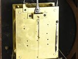 a clock that is sitting in a wooden case