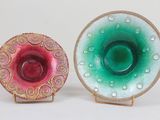 two plates that are sitting side by side on a table