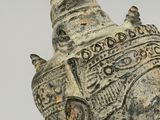 an old statue of a head with a crown on it ' s head