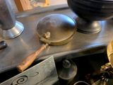 many different types of kitchen utensils on the counter