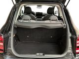the back of a car with its trunk open and the back seats down