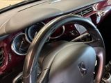 a close up of a steering wheel and dashboard of a car
