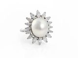 a white pearl and diamond ring