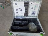 an open suitcase with tools in it sitting on the floor