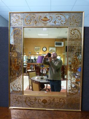 a man taking a picture of himself in a mirror