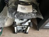 a robot that is sitting on the floor next to a bag