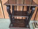 a wooden table with a shelf on top of it