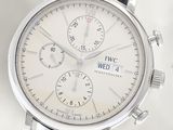 a close up of a wrist watch with a white dial