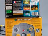 two nintendo wii controllers sitting on top of each other on a table