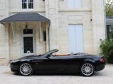 a black convertible car parked in front of a house
