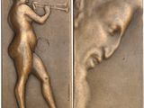 two bronze plaques depicting a man playing a trumpet and a woman playing a trumpet