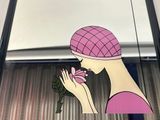 a picture of a woman holding a flower in her hand