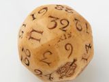 a close up of a dice with numbers on it on a white surface