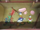 a toy set of donald duck, donald duck, donald duck, donald duck and donald duck in a suitcase