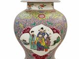 a vase with a lid that has a painting on it